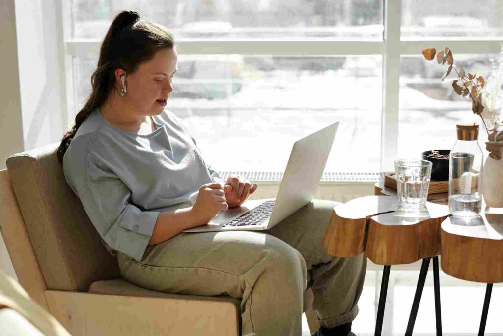 Lady with learning disability on laptop